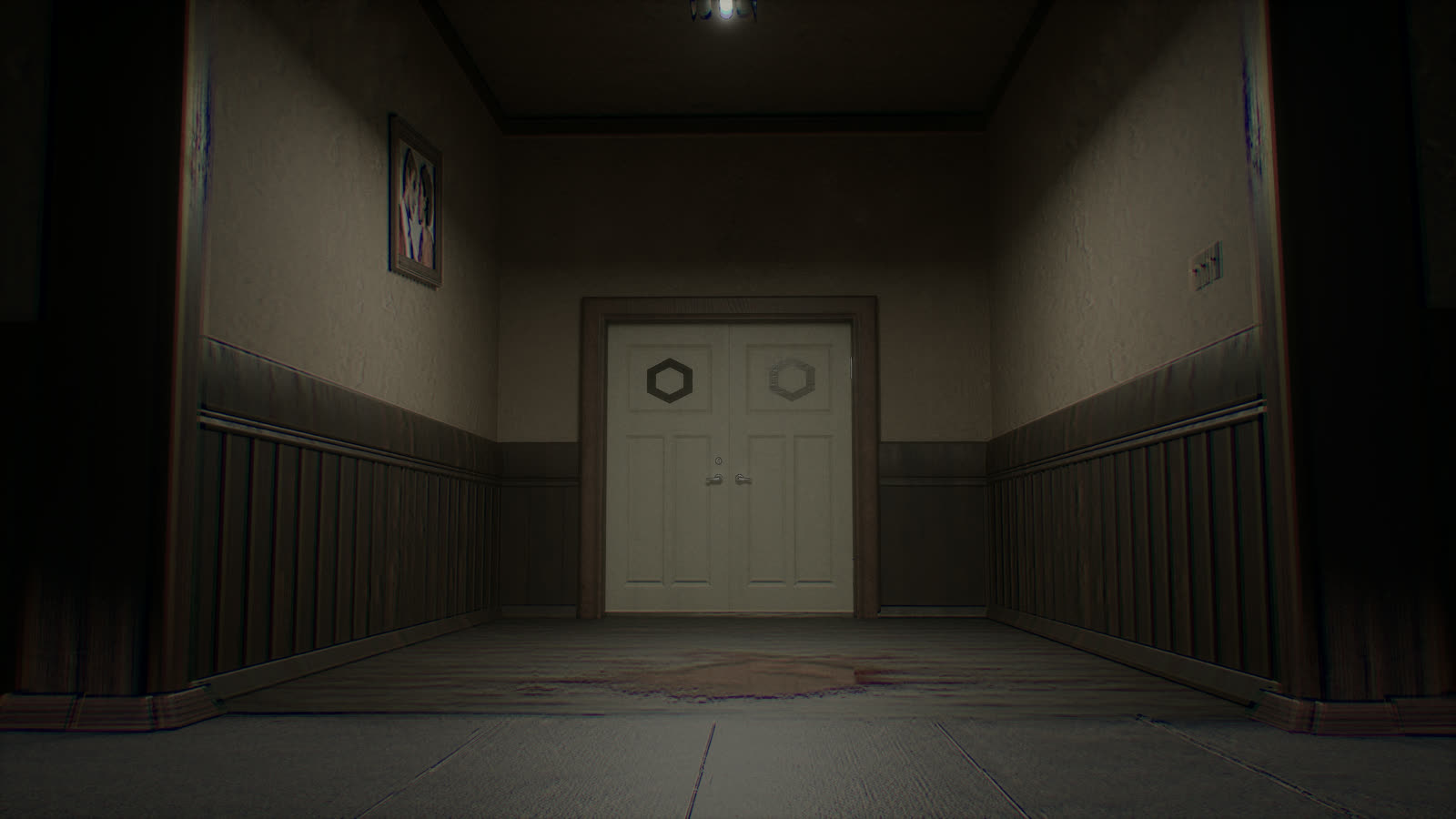 Double doors at the end of a corridor