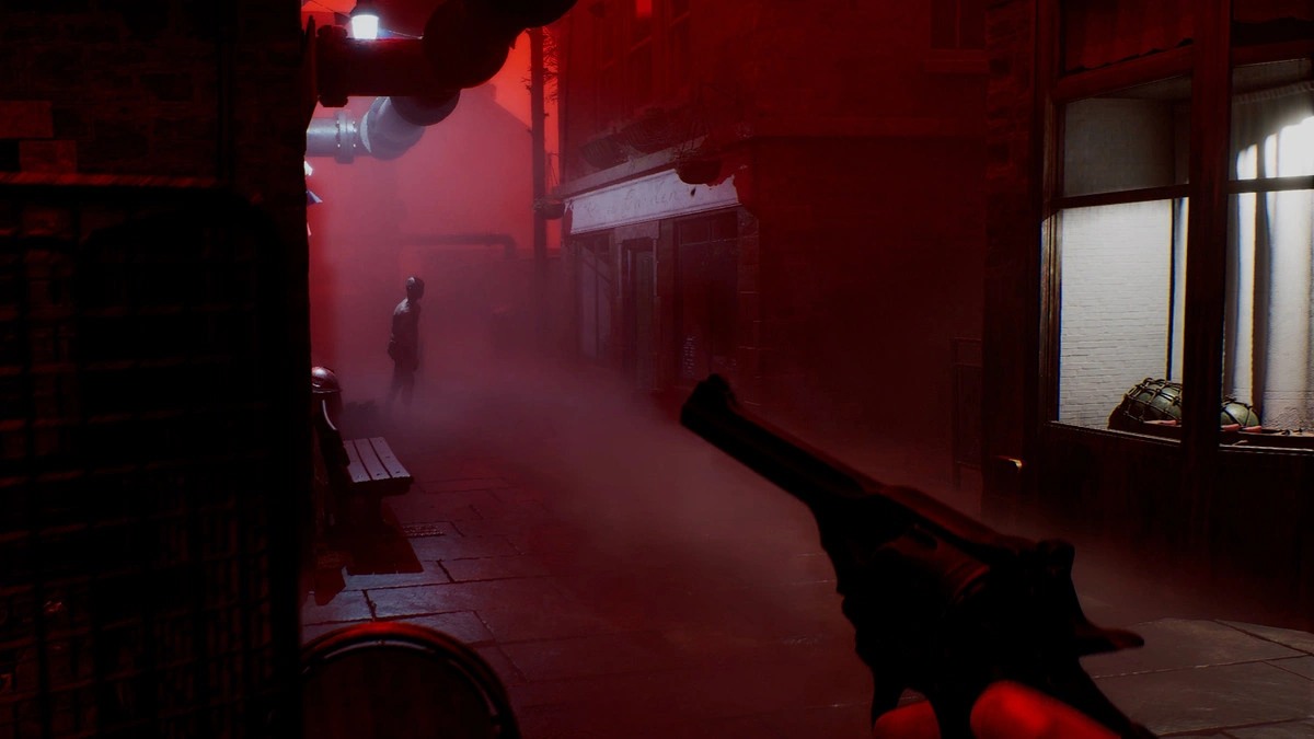 A player points a gun at an indistinct figure in an alley in ‘SILENT HILL: Townfall’.