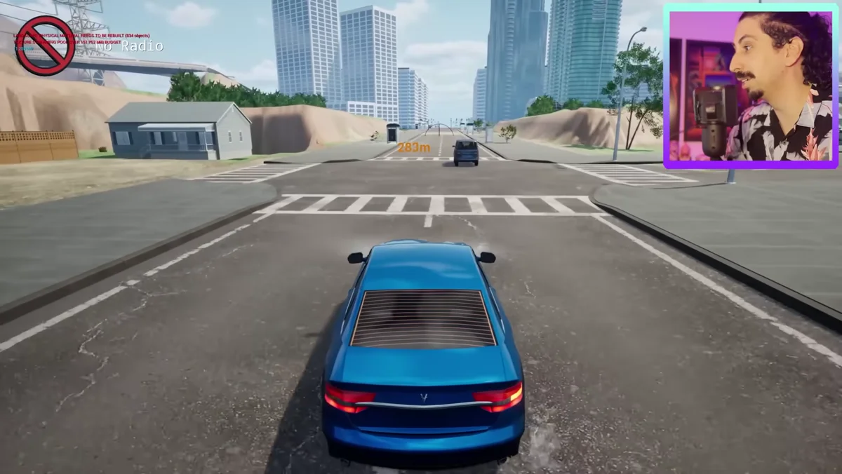Carro azul se aproximando de faixa de pedestres em cruzamento